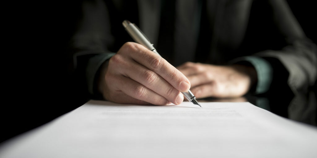 A person signing a document